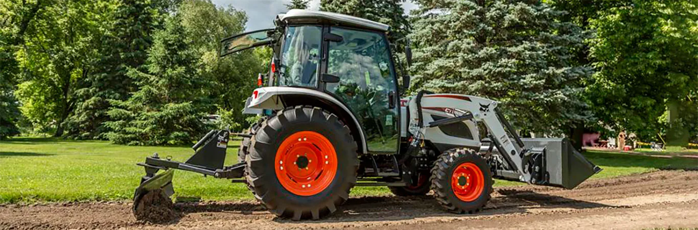 Compact Tractor Grading Road
